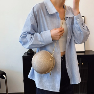Chic champagne gold spherical crossbody bag with metal chain strap for evening parties