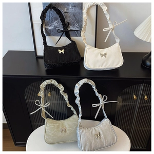 Collection of pleated hobo bags with metallic butterfly buckles in four stylish colors