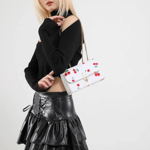 White crossbody chain bag with red cherry prints and golden metal buckle for women