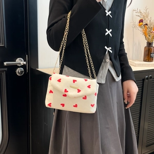 Chic cream corduroy shoulder bag with red heart print and elegant gold chain strap
