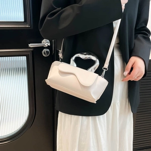 Elegant white crossbody bag with wavy flap and metallic handle for women's fashion