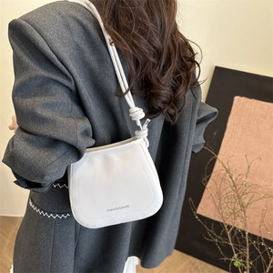 Minimalist beige PU leather bucket bag for women with fashion lettering and knot strap