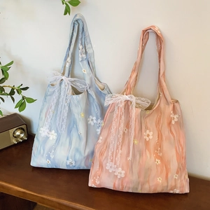 Floral canvas tote bags in blue and pink with lace bows and flower embroidery