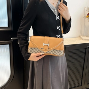 Orange leather and monogram canvas crossbody bag with metal H-clasp for women