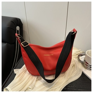 Detailed close-up of the red crescent moon tote bag with golden fashion text and wide strap