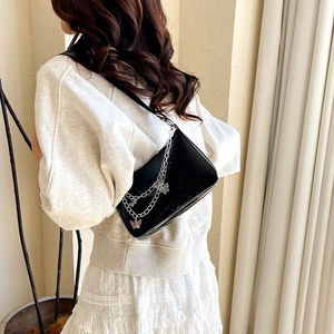 Quilted black patent leather shoulder bag with silver butterfly chain charms for women
