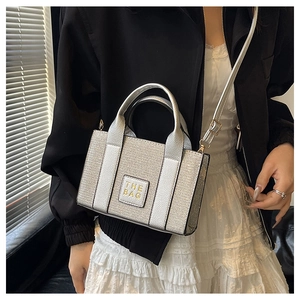 Silver sequin mini crossbody bag with THE BAG leather patch and adjustable strap