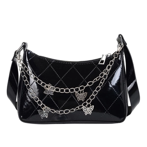 Glossy black patent leather underarm bag with butterfly chain and quilted pattern