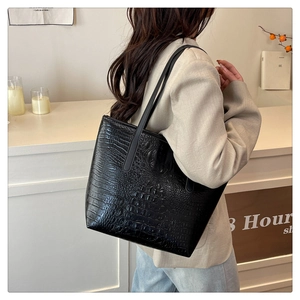 Close-up of black crocodile pattern faux leather tote bag with large capacity