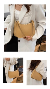 Close-up of yellow lychee texture on minimal shoulder bag with silver zipper and strap