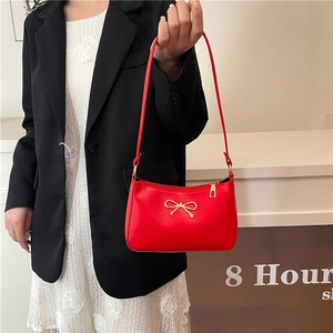 French red bow shoulder bag with gold metal clasp and retro minimalist leather texture