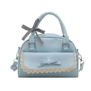 Light blue faux leather handbag with lace trim and bow accent shown on white background