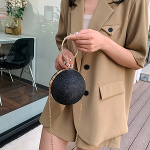 Spherical black glitter evening bag with rhinestone ring handle and gold chain strap