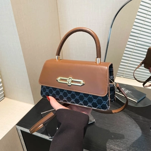 Vintage two-tone top-handle bag in brown leather and patterned canvas with gold buckle