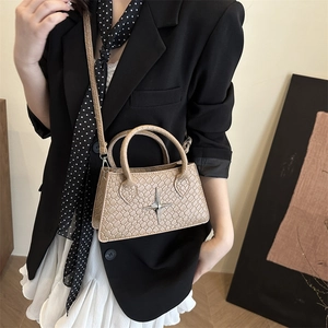 Chic beige crocodile pattern crossbody bag with silver star hardware and slim strap