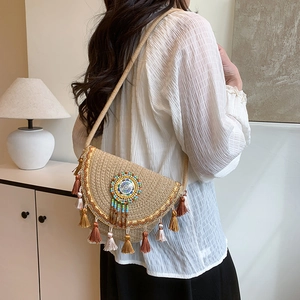 Bohemian straw crossbody saddle bag with colorful tassels and ethnic bead embroidery