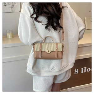 Detail view of retro color-block crossbody bag featuring woven texture and metal lock