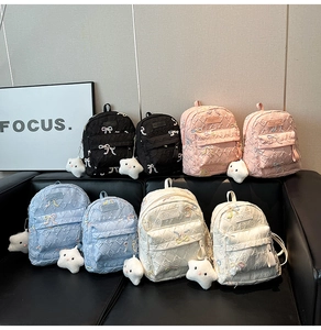 Detailed display of mini quilted backpacks in four colors with cute plush star pendants