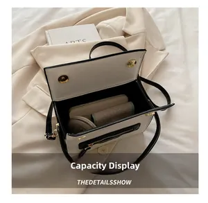 Display della capacità interna della borsa a contrasto che mostra lo spazio per gli oggetti