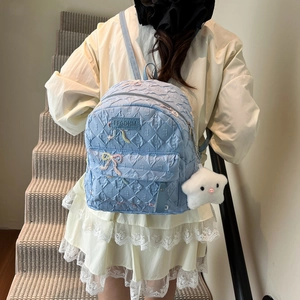 Blue quilted backpack with bow embroidery and star plush pendant for student travel