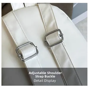 Detail display of white PU leather shoulder straps with adjustable silver metal buckles