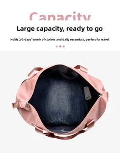 Top view of pink travel bag interior with large capacity and navy blue lining storage