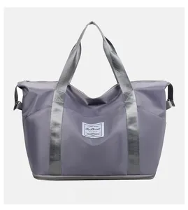 Detail view of expandable travel bag featuring waterproof nylon and adjustable buckles