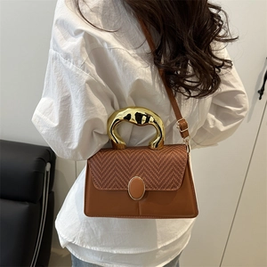 Brown woven patchwork crossbody bag with stylish gold handle and adjustable strap