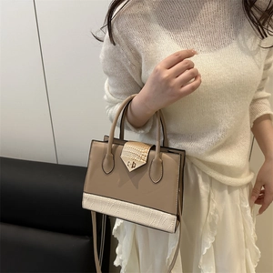 Fashionable brown and white patchwork square tote bag with elegant golden rotary lock