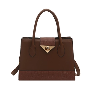 Brown patchwork leather tote bag with gold triangle lock and crocodile texture details