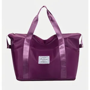 Large purple waterproof nylon travel bag with expandable bottom and fashion patch