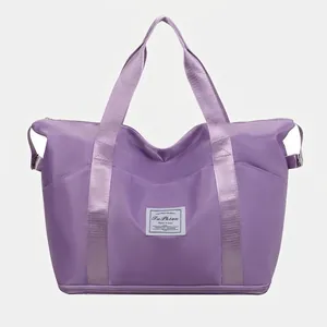 Purple large capacity travel tote bag with expandable bottom and waterproof nylon fabric