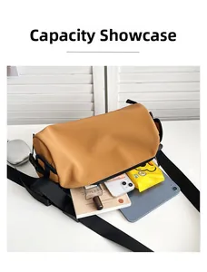 Open view showing large internal capacity of the tan cylinder shoulder bag