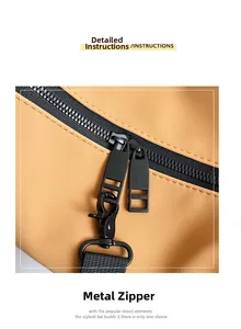 Detail of khaki barrel bag featuring black metal zippers and sturdy carabiner clip