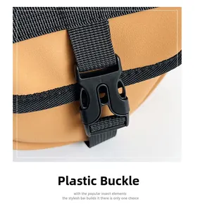 Close-up of durable black plastic buckle and nylon strap on a brown cylinder bag