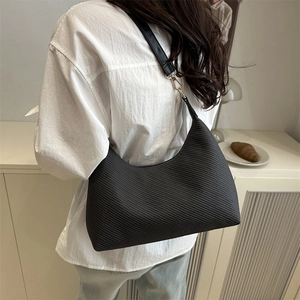 Minimalist black hobo shoulder bag in oil wax texture leather for women daily commuting