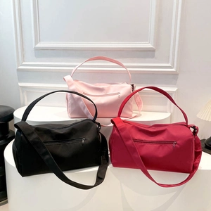 Waterproof nylon sports gym bags for women in black, pink, and burgundy colors