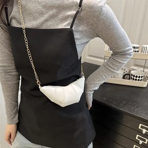 Minimalist white croissant mini shoulder bag with gold chain strap on model