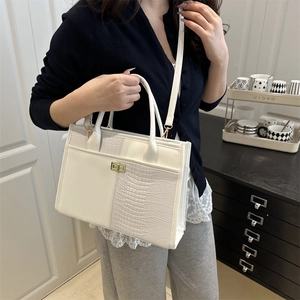 Chic beige crocodile texture tote bag with gold rotary lock and adjustable strap