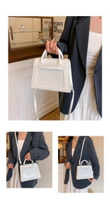 Detail of white square handbag featuring a clear PVC front pocket and adjustable strap