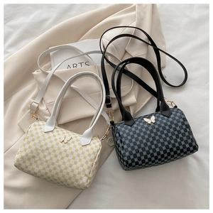 Detail of Boston bags with vintage prints and elegant butterfly metal buckle closure