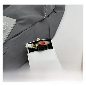Interior view showing the storage capacity of the white chain bag for cosmetics