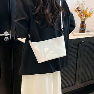White lychee pattern leather bucket bag for women with minimalist shoulder strap design