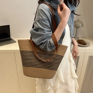 French woven beach tote bag with black stripes and brown fabric straps for daily summer use