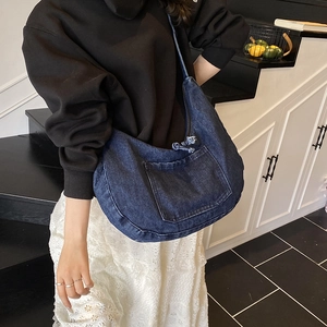 Retro denim hobo crossbody bag in dark blue with spacious design and drawstring detail