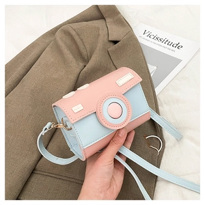 Detail of creative camera-shaped crossbody bag featuring pink and blue PU leather patchwork
