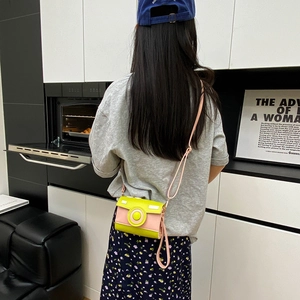 Cute camera-shaped crossbody bag in yellow and pink contrast leather with shoulder strap