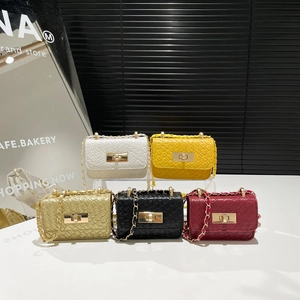 Collection of woven chain crossbody bags with metal turn-lock closures in five colors