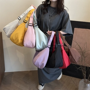Large nylon crossbody bag in multiple colors with adjustable strap for casual wear