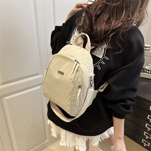 Chic beige nylon backpack with waterproof finish and metal logo for women's daily commute